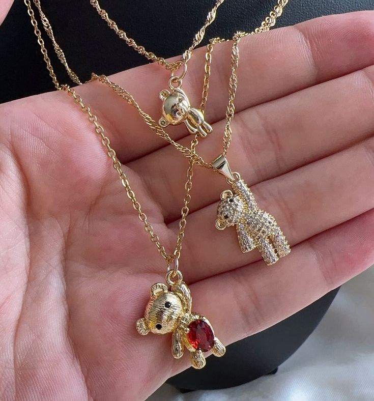 Embrace the charm and whimsy of nature with our enchanting bear necklace. Crafted in gleaming metal, each intricately detailed bear pendant captures the spirit of these majestic creatures