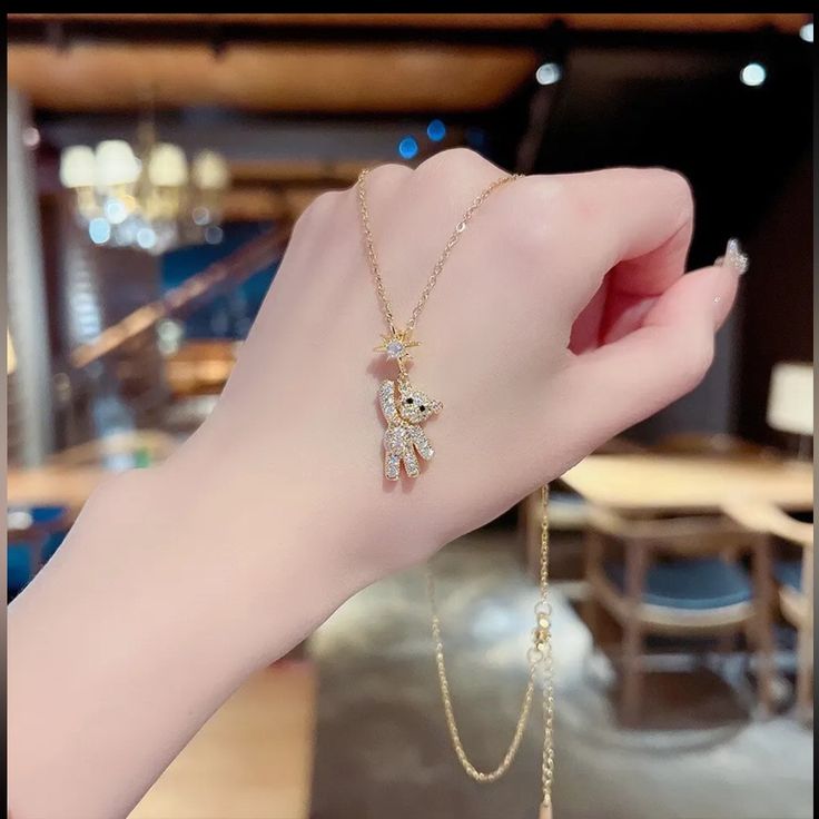 Adorn yourself with adorable charm: Teddy bear necklaces. Delicate chains hold cute, intricately crafted teddy charms, evoking warmth, nostalgia, and playful elegance.